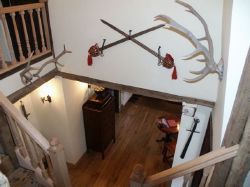 The Scottish Hunting Lodge starts to become apparent as one begins to behold mediaeval weapons, antlers and of course luxurious and sophisticated Scottish tartan!